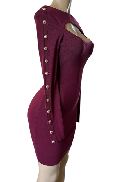Burgundy dress with button details on a mannequin against a white background
