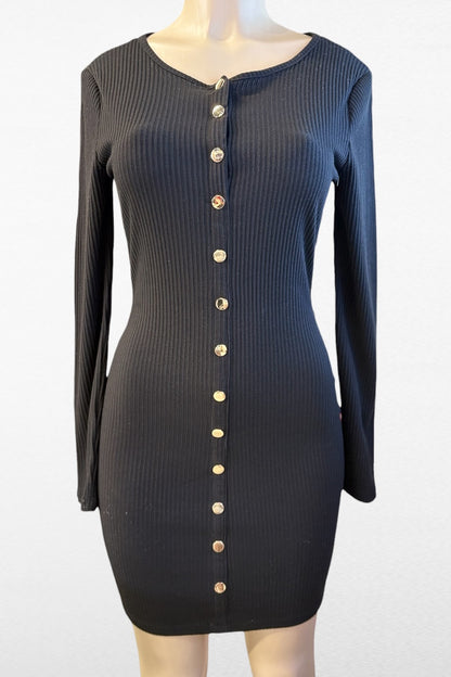 Black ribbed dress with button details on a mannequin against a white background