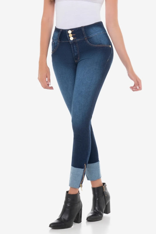 Person wearing blue jeans with a white background