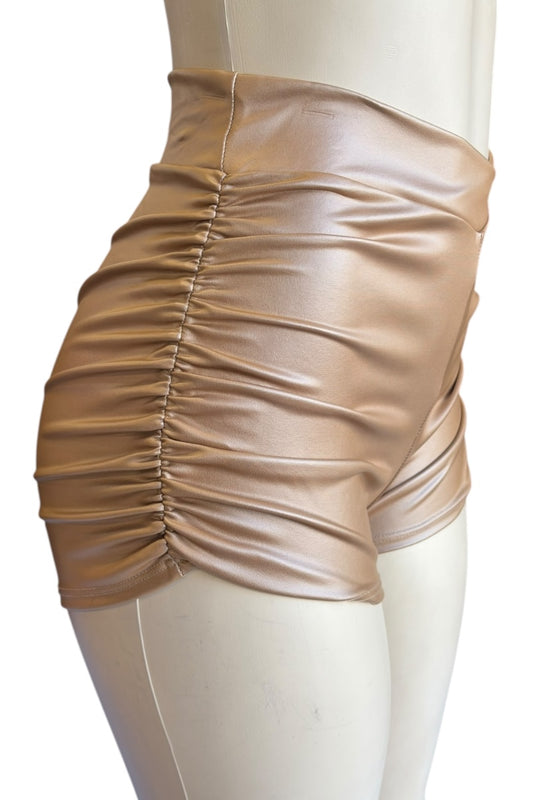 brown faux leather shorts on a mannequin against a white background