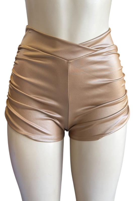 brown faux leather shorts on a mannequin against a white background