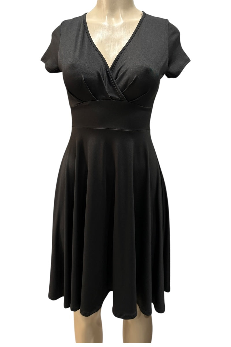 Black dress on a mannequin against a white background