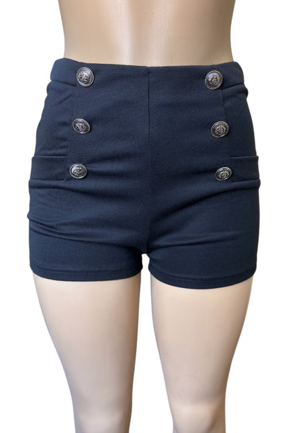 black shorts with button details on a mannequin against a white background