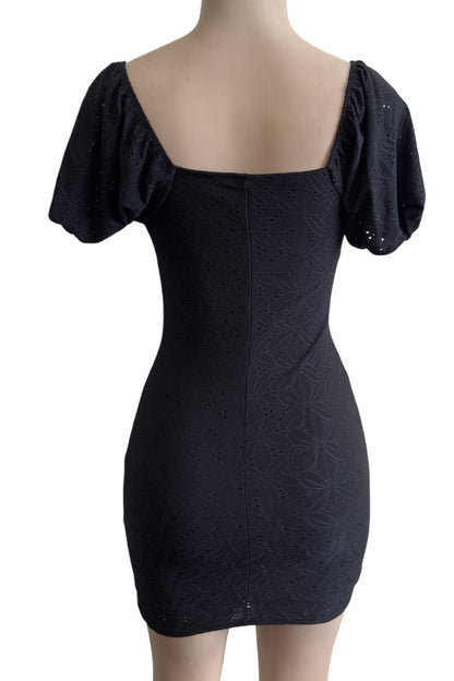 Black dress with puff sleeves on a mannequin against a white background