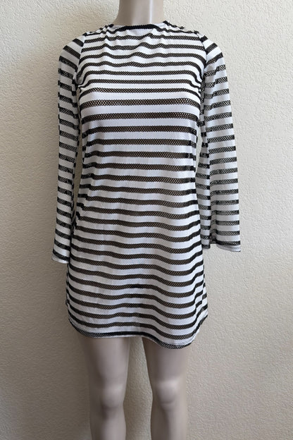 Black and white striped dress on a mannequin against a plain background