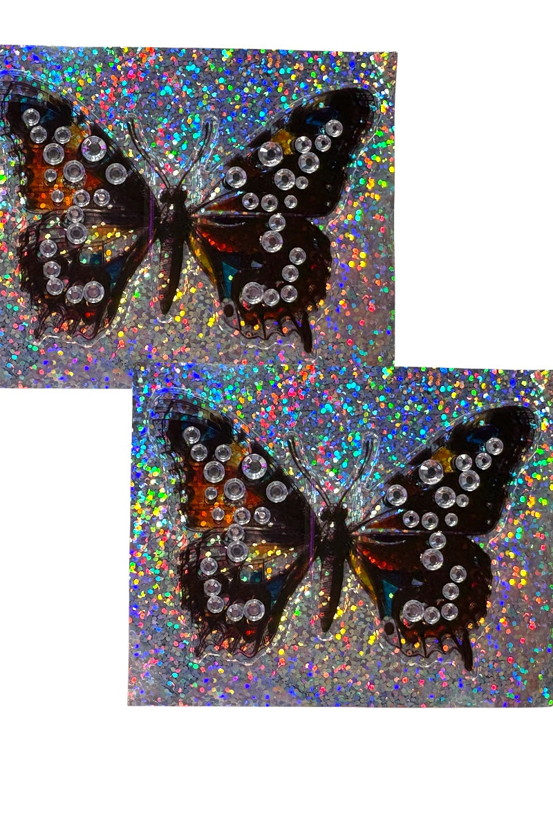 Butterfly-shaped pasties with rhinestones on a glittery background
