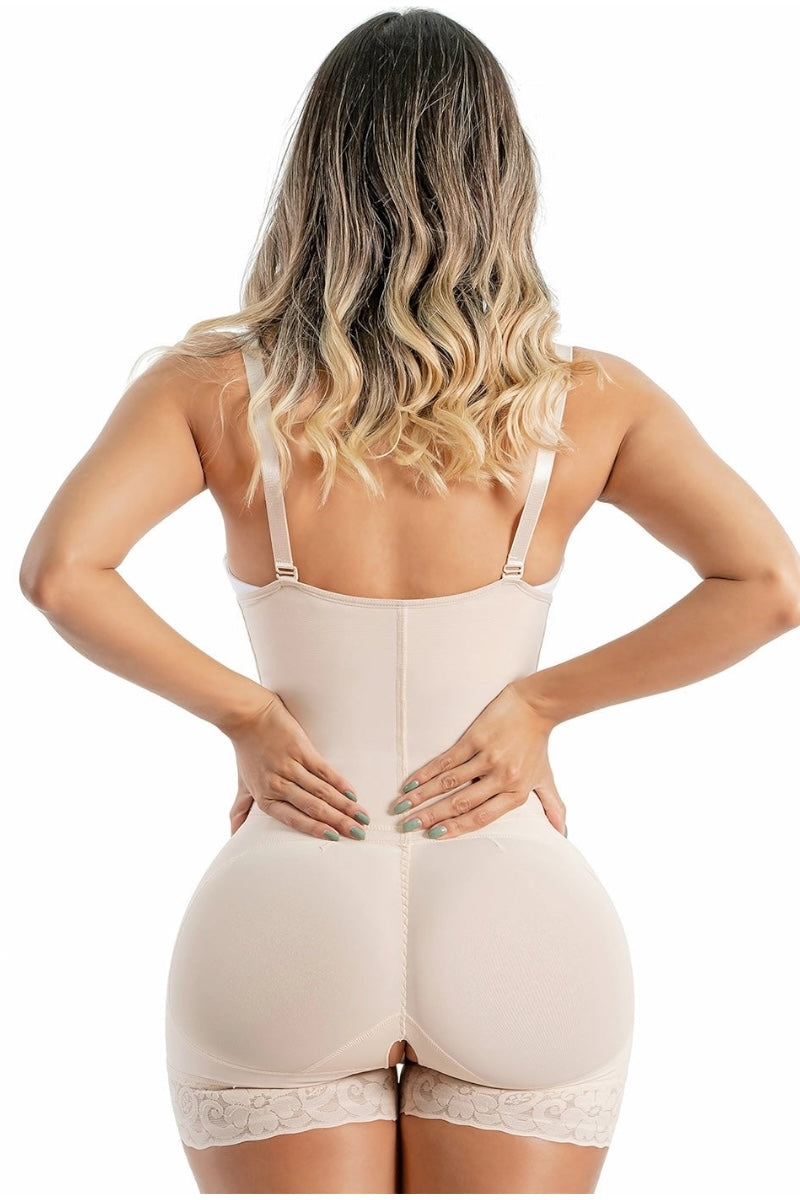 Woman wearing a beige shapewear garment on a white background