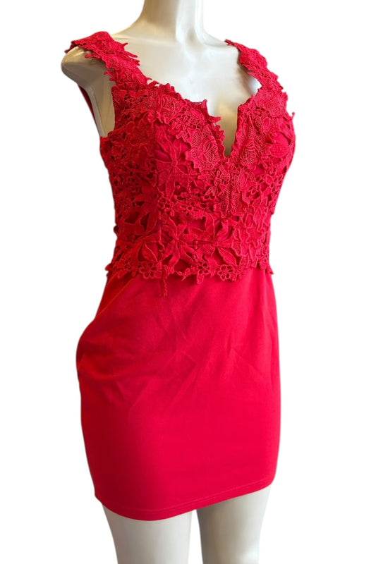 Red lace dress on a mannequin against a white background