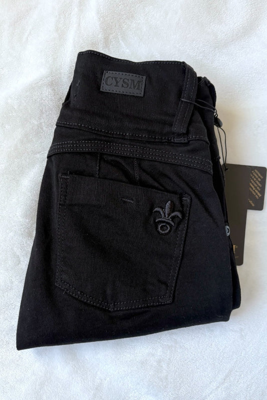 Black pants with a brand tag on a white background