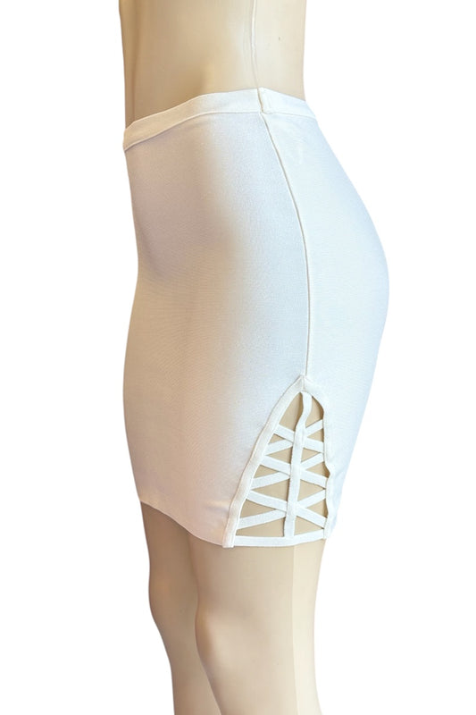 cream skirt with open detailing on a mannequin against a white background