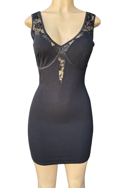 Black dress with lace details on a mannequin against a white background