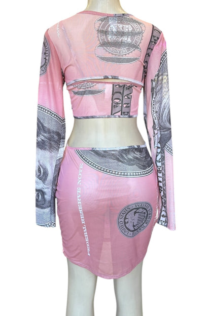 Mannequin wearing a pink dress with money print design on a white background