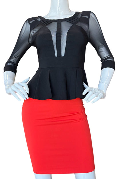 Black top with sheer sleeves and red skirt on a mannequin against a white background