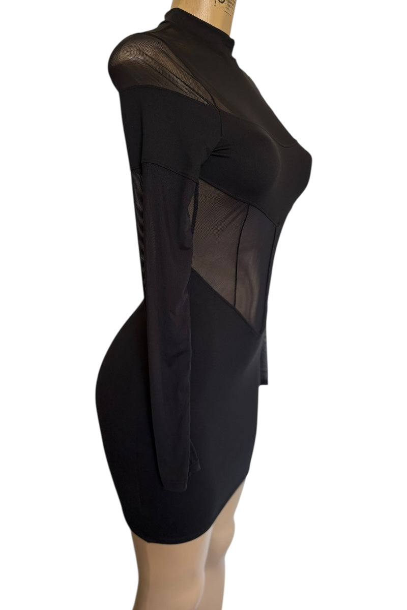 Black dress with sheer panels on a white background