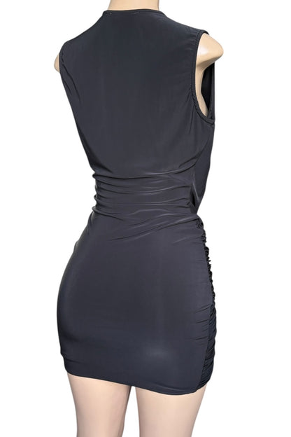 Black sleeveless dress on a mannequin against a white background