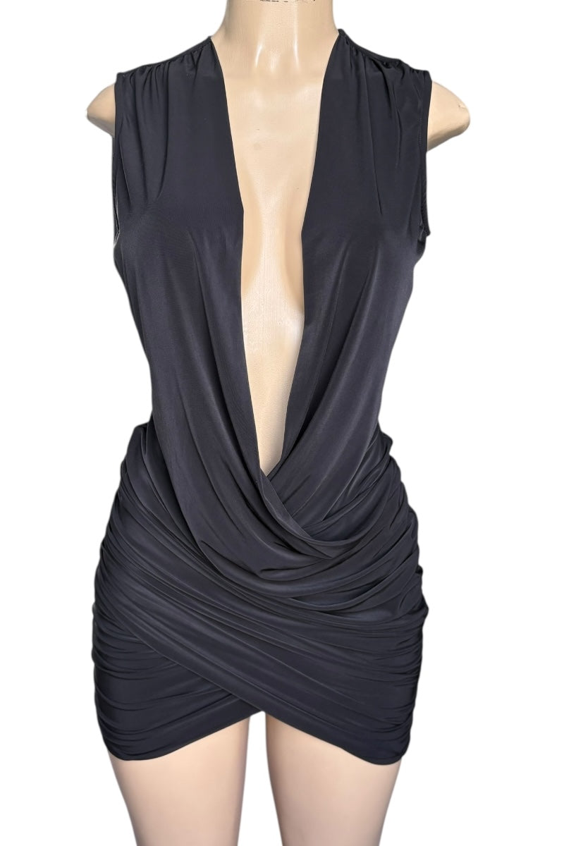 Black sleeveless dress with a deep neckline on a mannequin against a white background