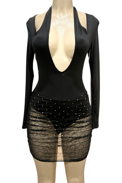 Black outfit with a deep neckline and sheer skirt on a mannequin against a white background