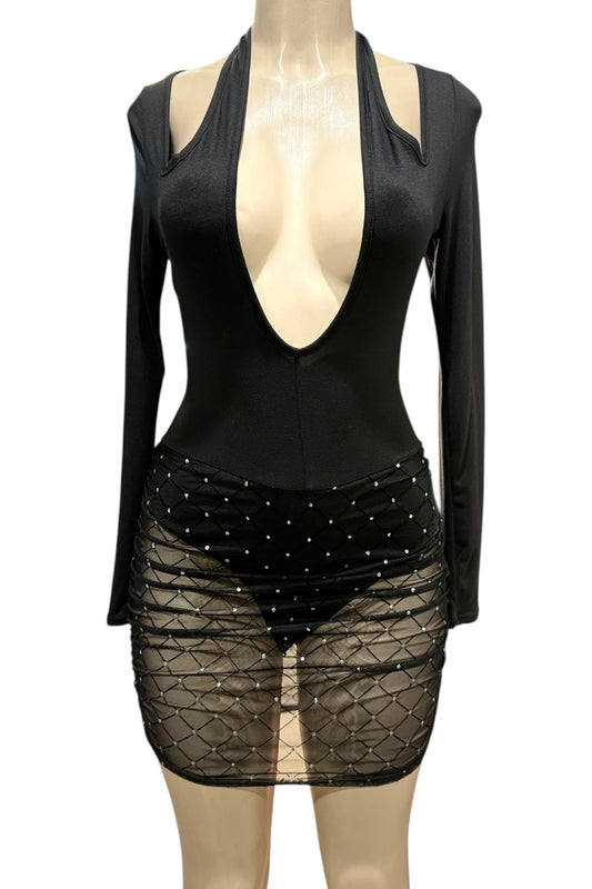 Black outfit with a deep neckline and sheer skirt on a mannequin against a white background