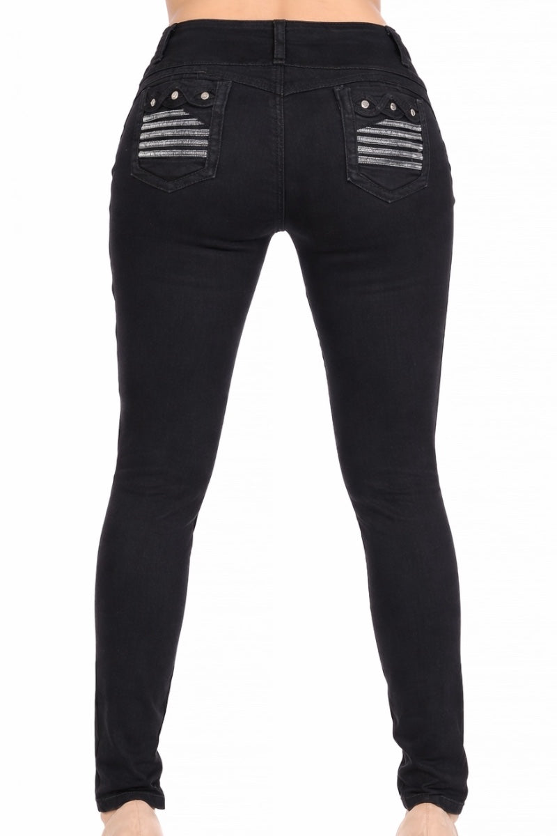 Black jeans with decorative pockets on a model