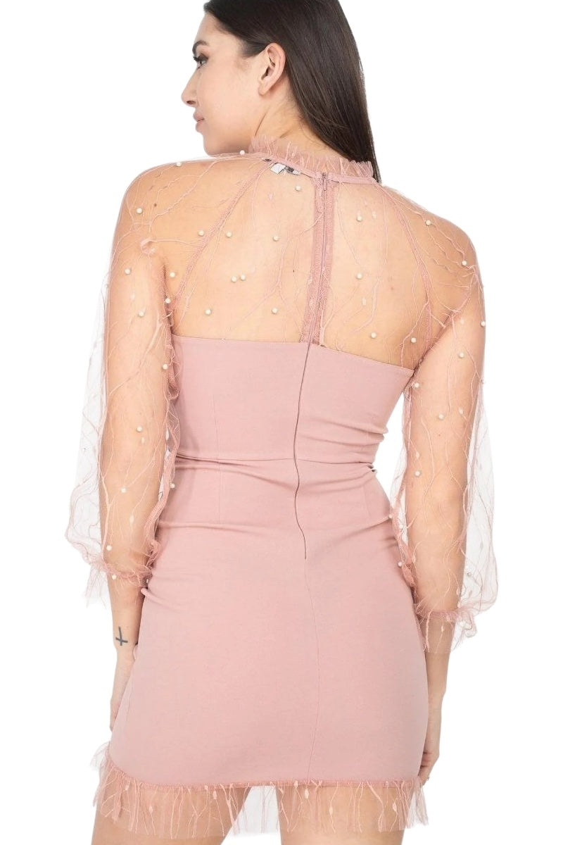 Pink dress with sheer overlay and embellishments on a white background