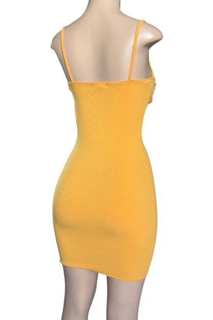 Mustard dress on a mannequin against a white background