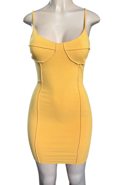 Mustard dress on a mannequin against a white background