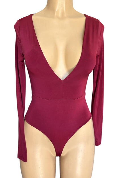 Burgundy bodysuit with long sleeves on a mannequin against a white background