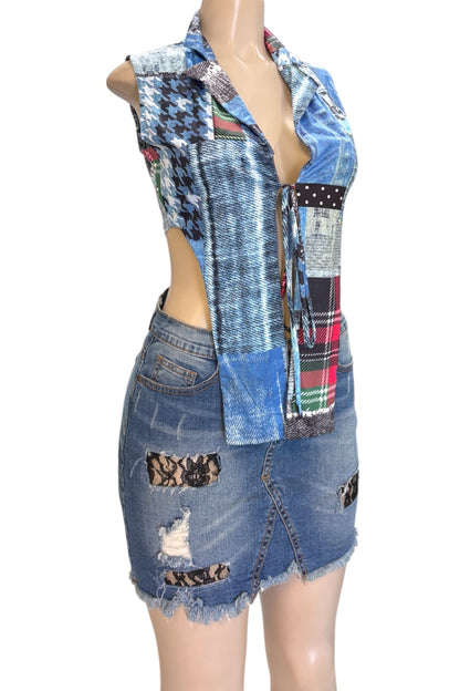 Mannequin wearing a patchwork denim top and skirt on a white background
