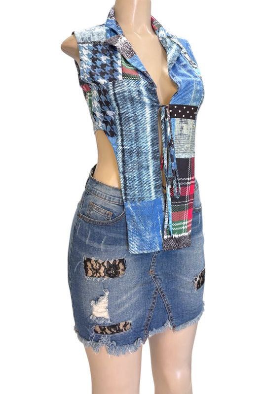 Mannequin wearing a patchwork denim top and skirt on a white background