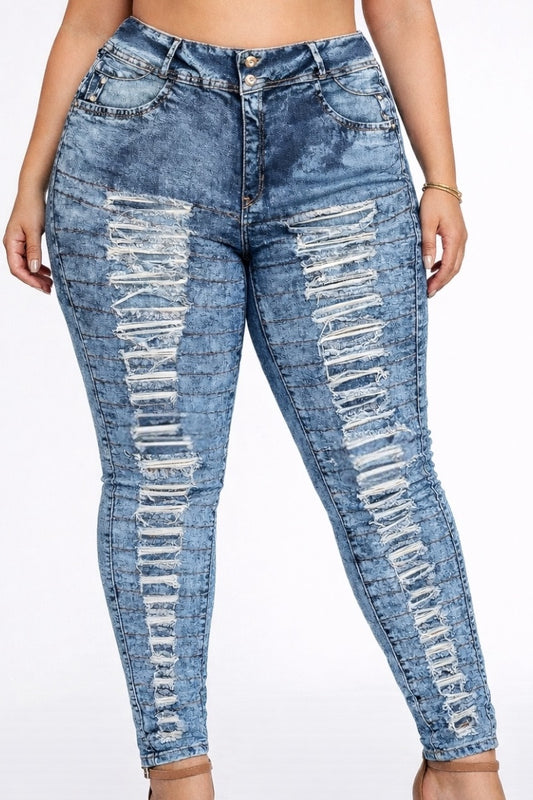 Blue distressed jeans worn by a person on a white background