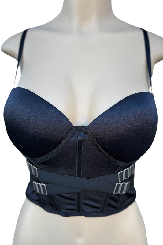 Black crop top on a mannequin with a white background