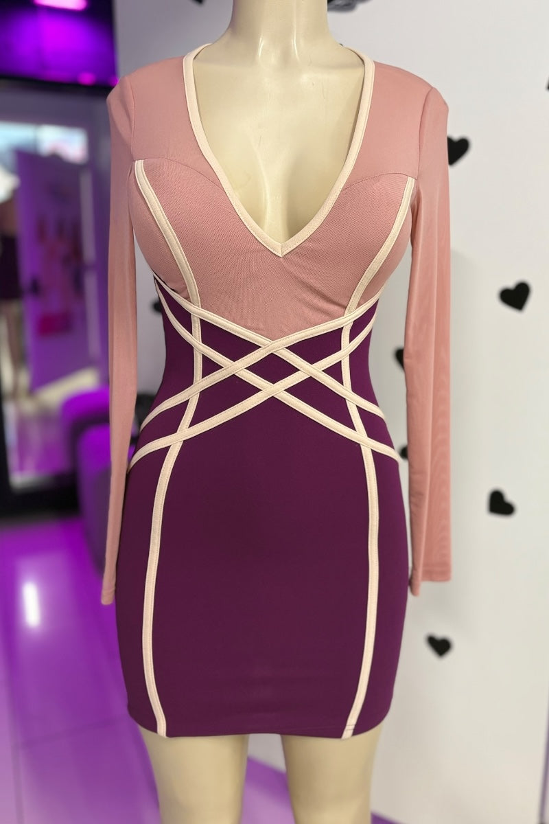 Mannequin wearing a dress with a pink top and purple bottom on a white background.