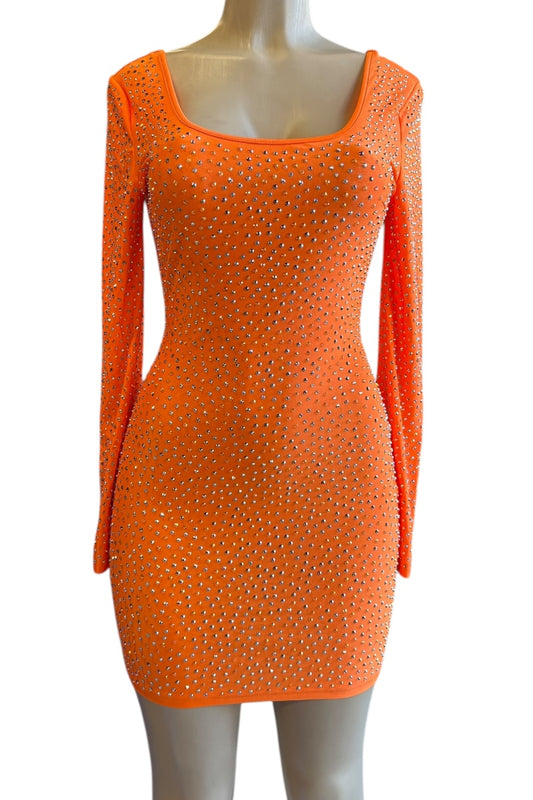 Orange dress with rhinestone embellishments on a mannequin against a white background