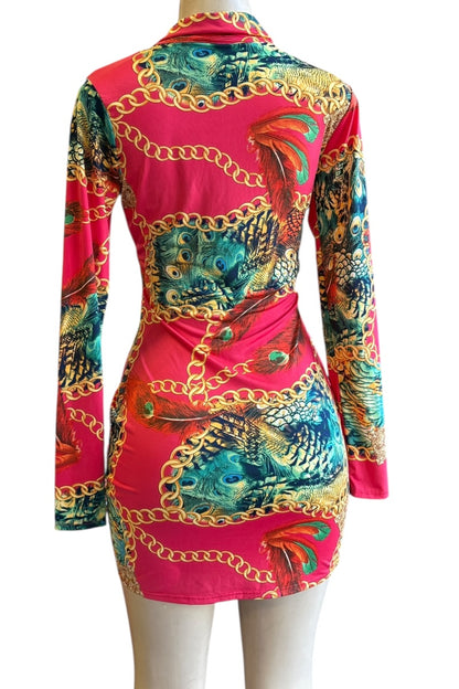 Colorful dress with peacock print and gold chain details on a white background