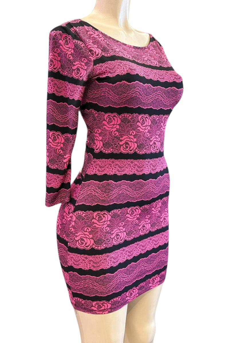 Pink and black striped dress on a mannequin against a white background