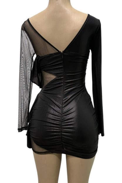 Black dress with sheer sleeves on a mannequin against a white background