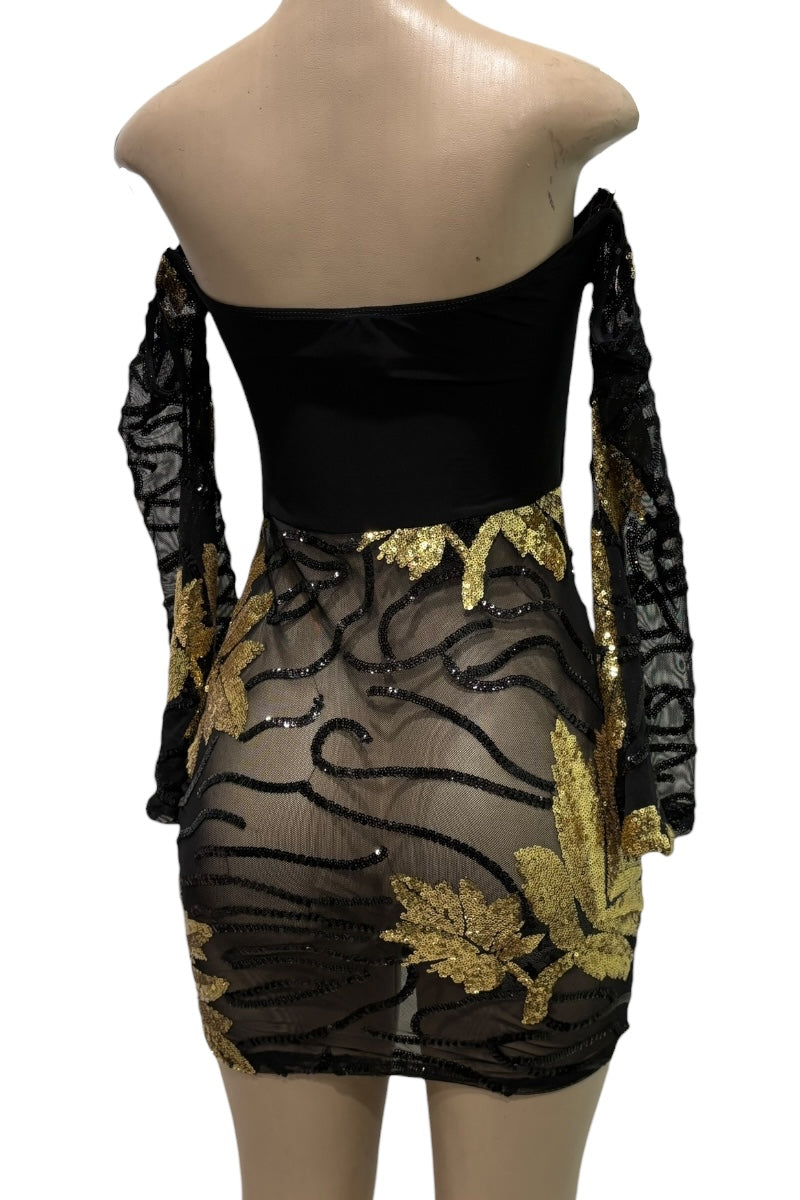 Black off-shoulder dress with gold floral embroidery on a mannequin.