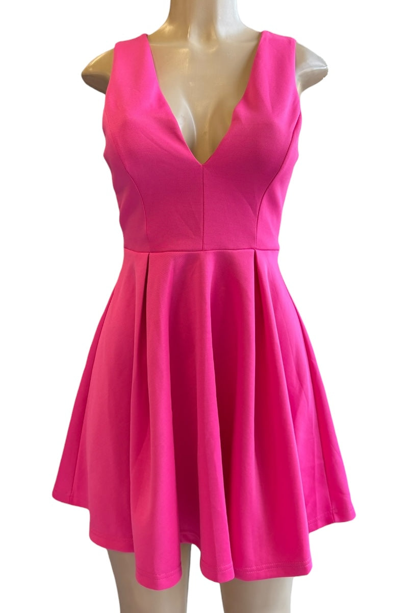 Hot pink dress on a mannequin against a white background