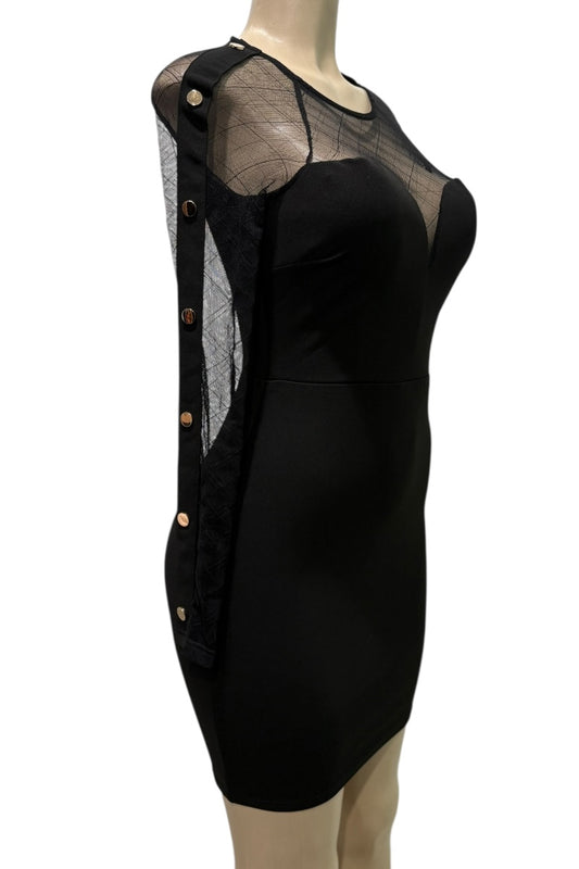 Black dress with sheer panels on a mannequin against a white background