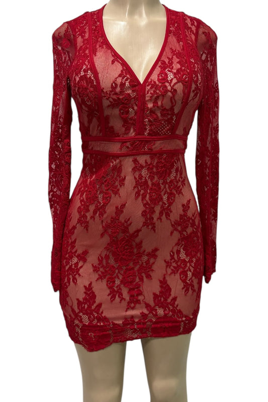 Red lace dress on a mannequin against a white background