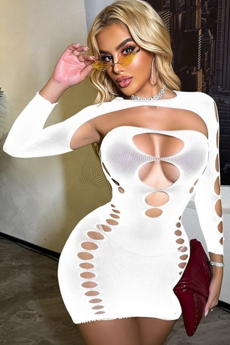 Woman wearing a white mesh dress with cut-out design, holding a red clutch.