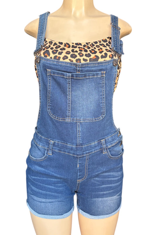 Blue denim overalls worn by a mannequin on a white background