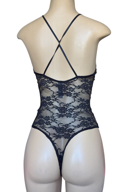 Black lace bodysuit on a mannequin against a white background