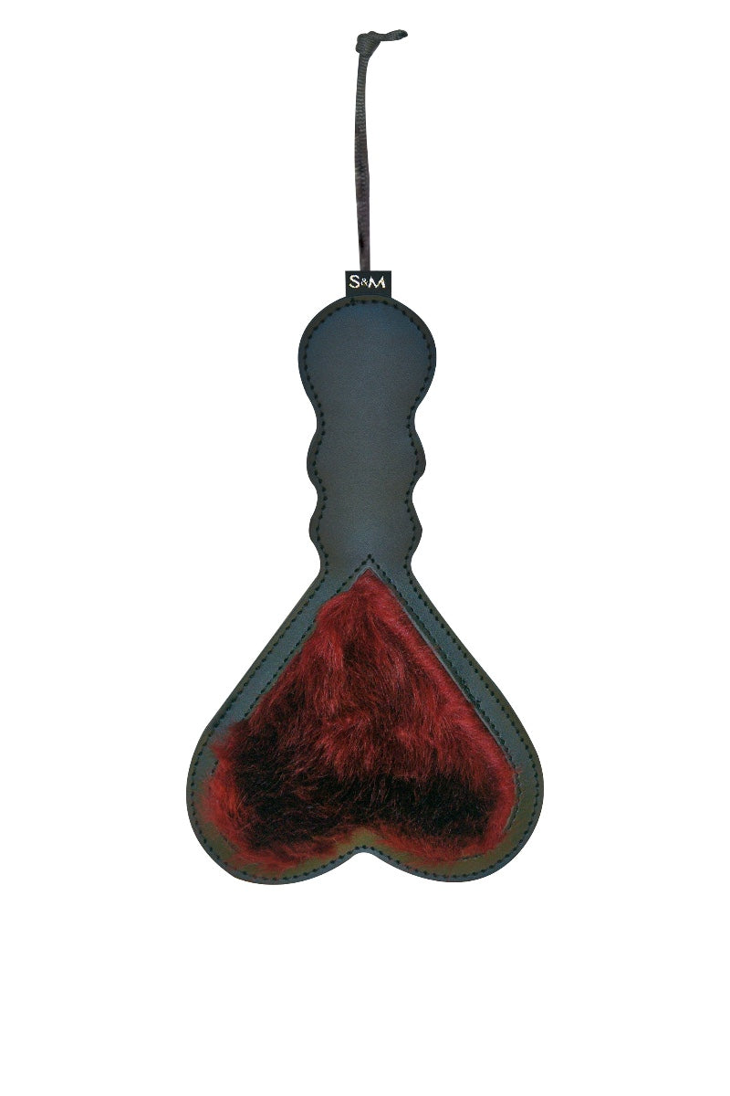 Heart-shaped paddle with red interior and black exterior on a white background