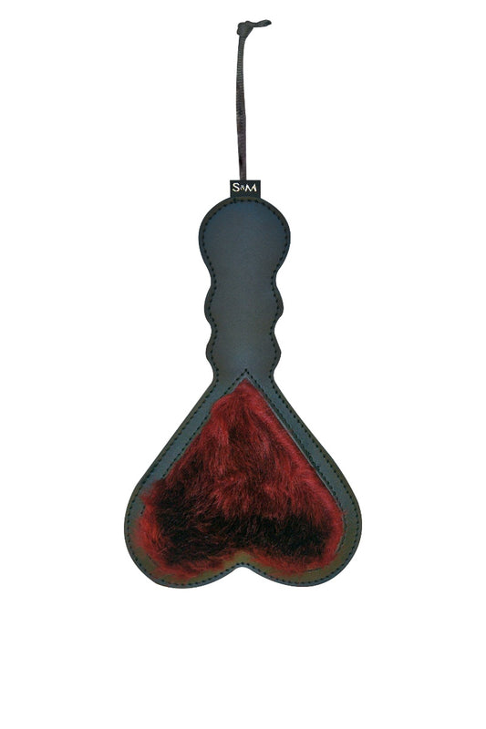 Heart-shaped paddle with red interior and black exterior on a white background