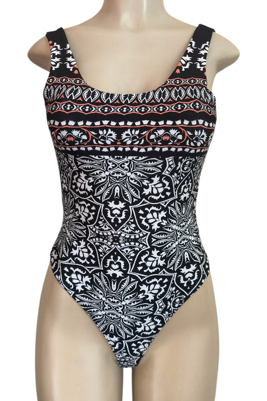 Black and white patterned bodysuit on a mannequin against a white background