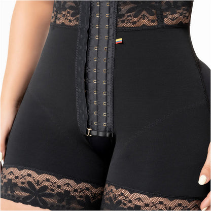 Black corset with lace details on a person wearing it.