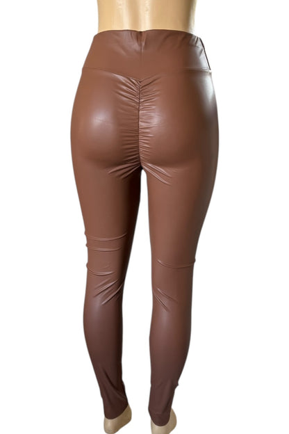 Brown leather leggings on a white background