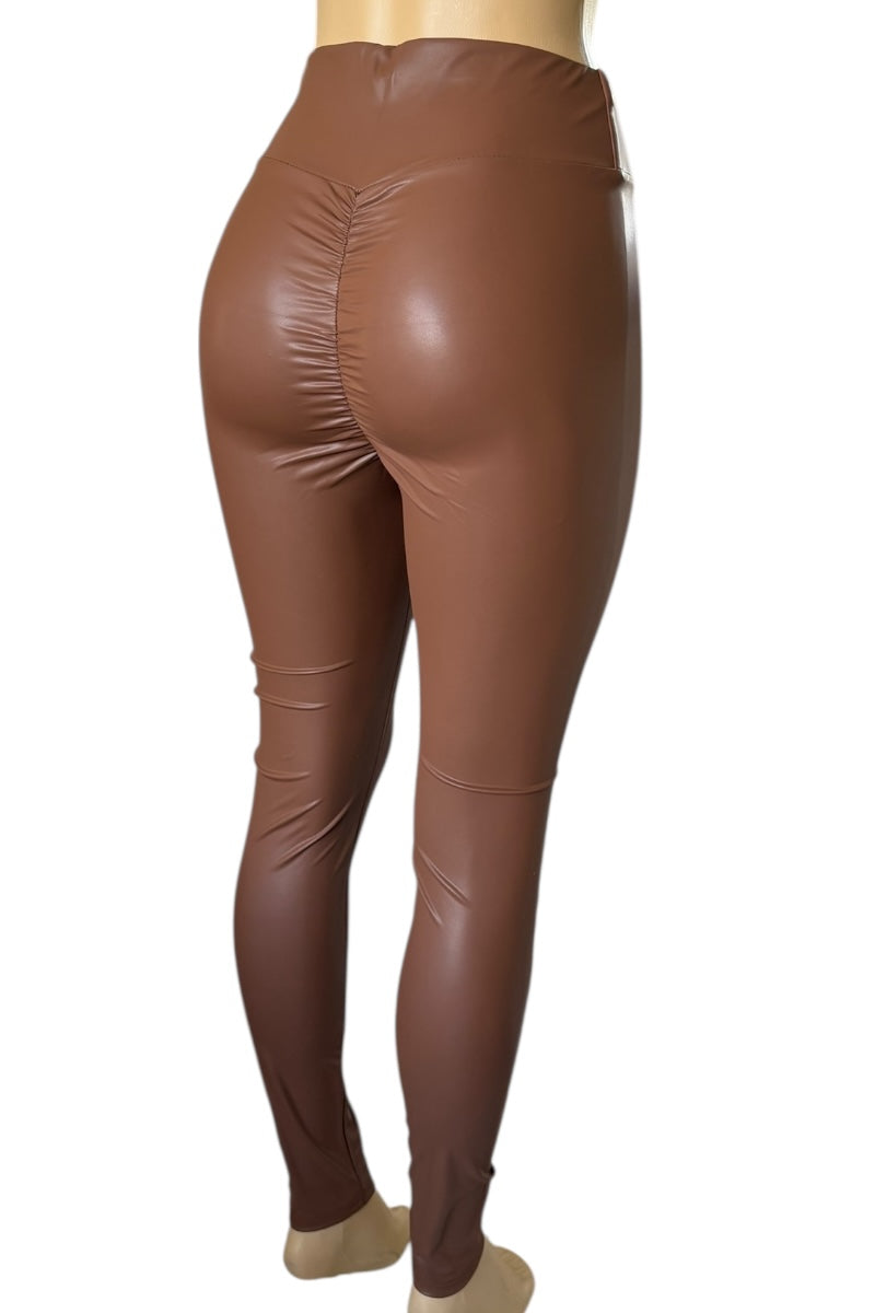 Brown faux leather leggings on a mannequin against a white background