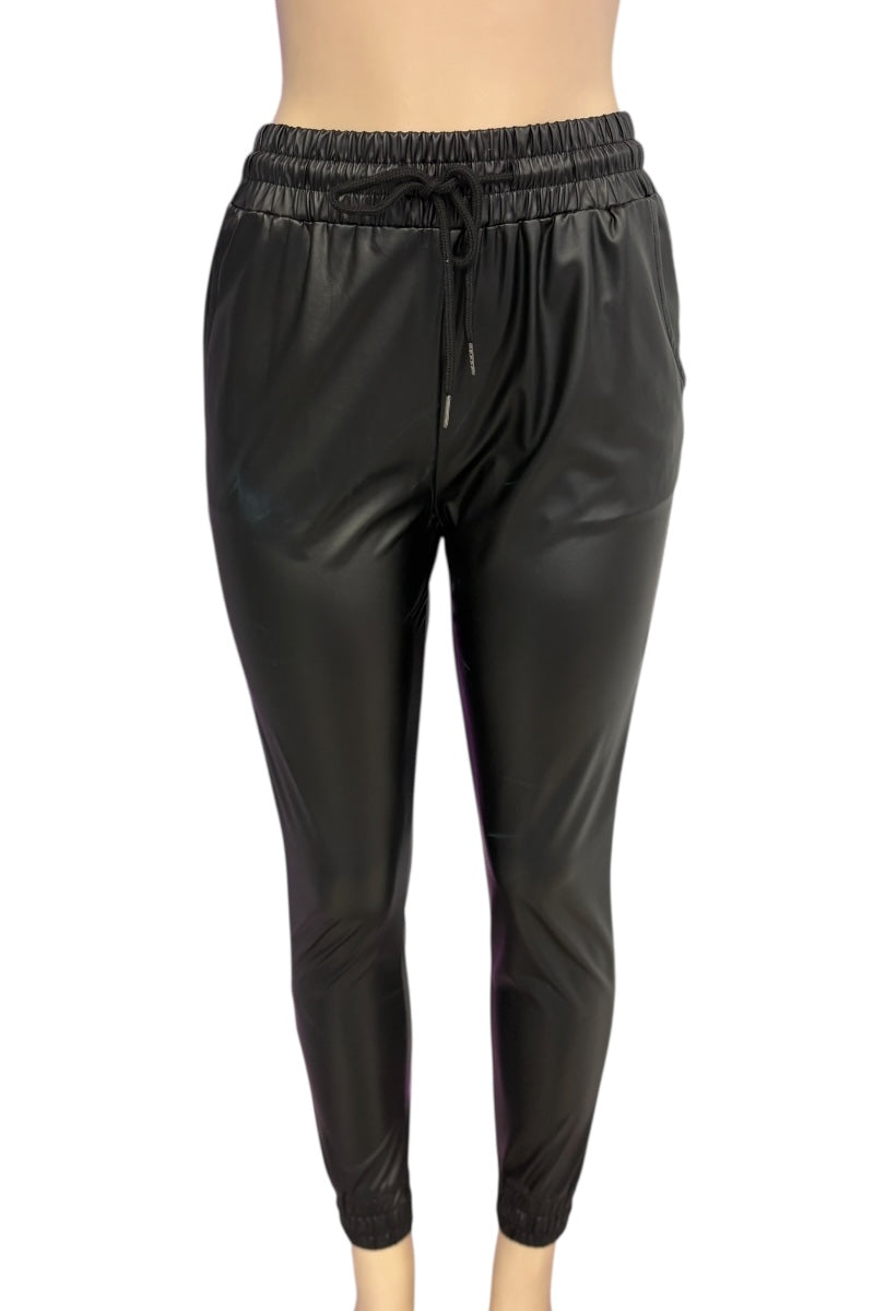 Black shiny pants on a white background